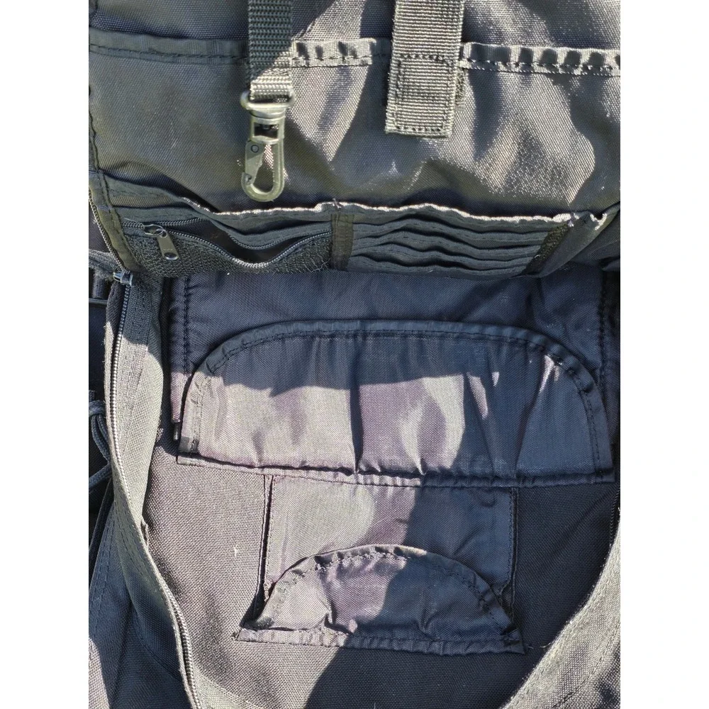 black tactical backpack is a Sandpiper of California Bugout Bag **see Pics**